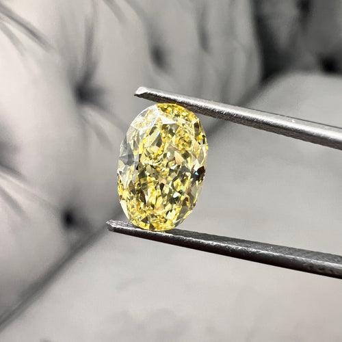 Fancy intense yellow oval shape. Fancy intense yellow. Oval yellow diamond.