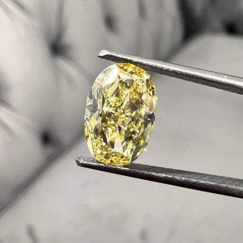 Fancy intense yellow oval shape. Fancy intense yellow. Oval yellow diamond.