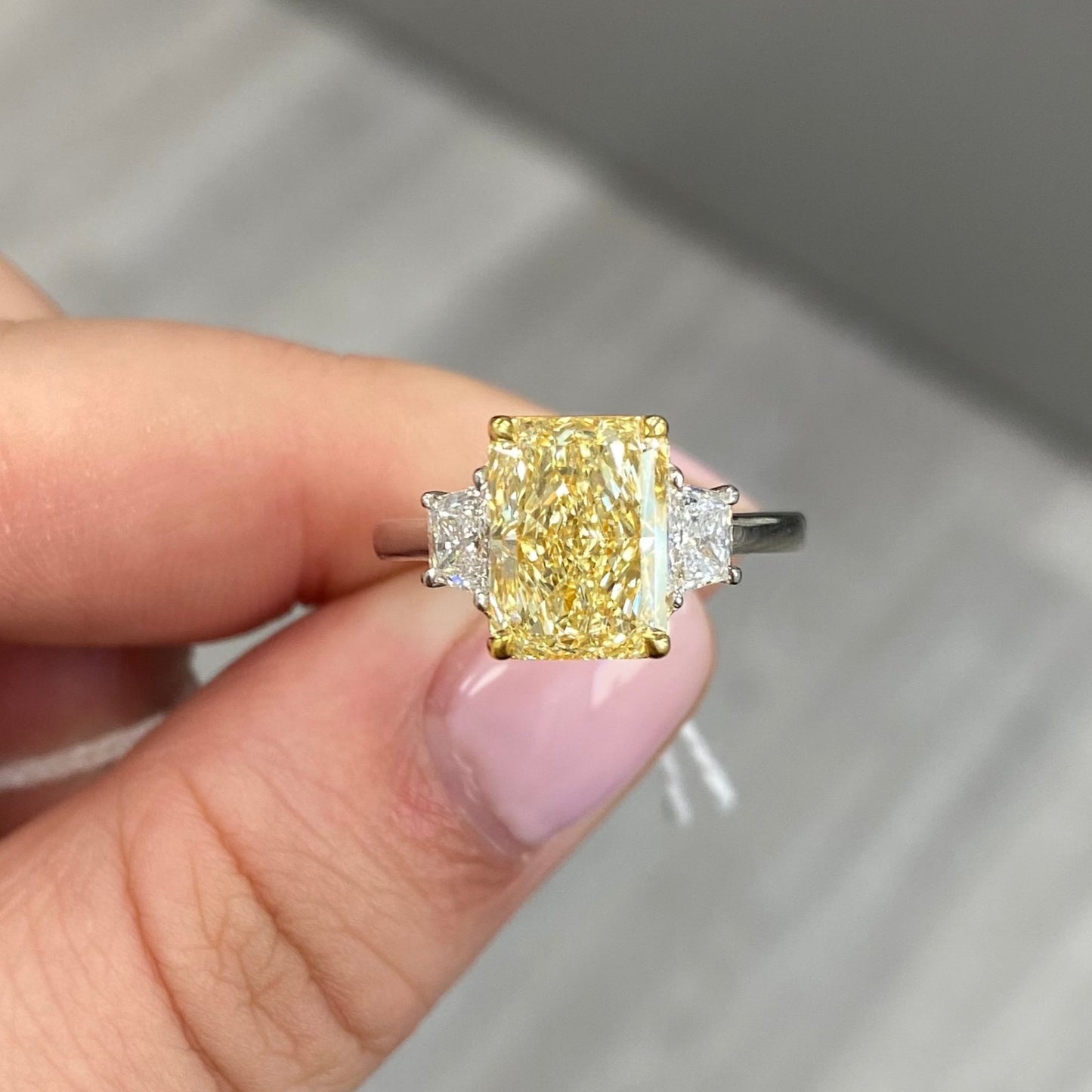 long radiant yellow diamond. yellow diamond ring. yellow diamond 3 stone ring. GIA yellow diamond ring