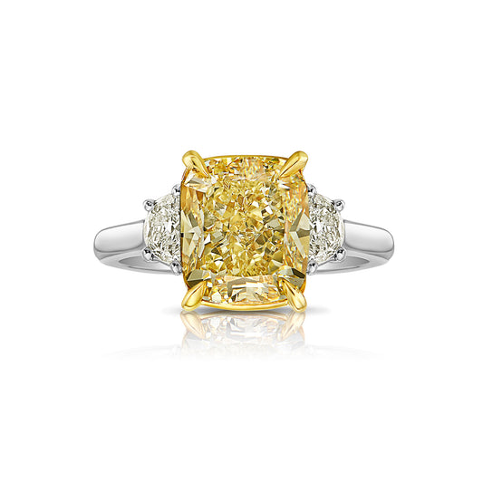 GIA yellow diamond, three stone ring. yellow diamond cushion. fancy light yellow. yellow diamond jewelry.