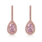 Handmade rose gold earrings featuring a rare matched pair of 2 carat each light pink pear shape diamonds and round pink diamonds