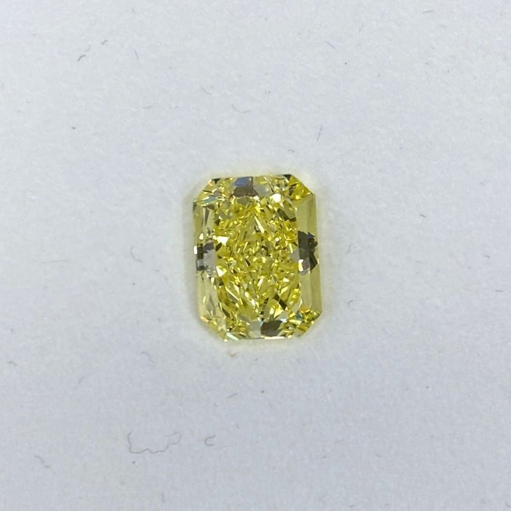 fancy intense yellow. intense yellow diamond. radiant cut diamond. intense yellow.
