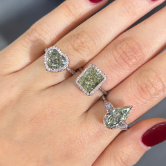 3 green diamond rings on hand 