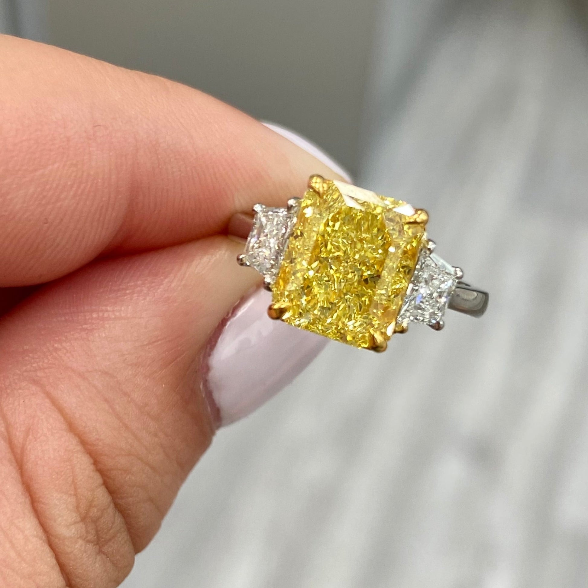 Fancy intense yellow elongated radiant diamond ring. Fancy intense yellow long radiant. Fancy intense yellow rectangular radiant