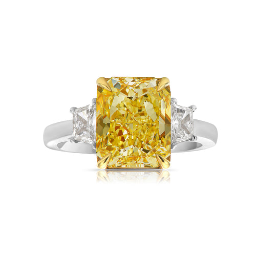 Fancy intense yellow elongated radiant diamond ring. Fancy intense yellow long radiant. Fancy intense yellow rectangular radiant.