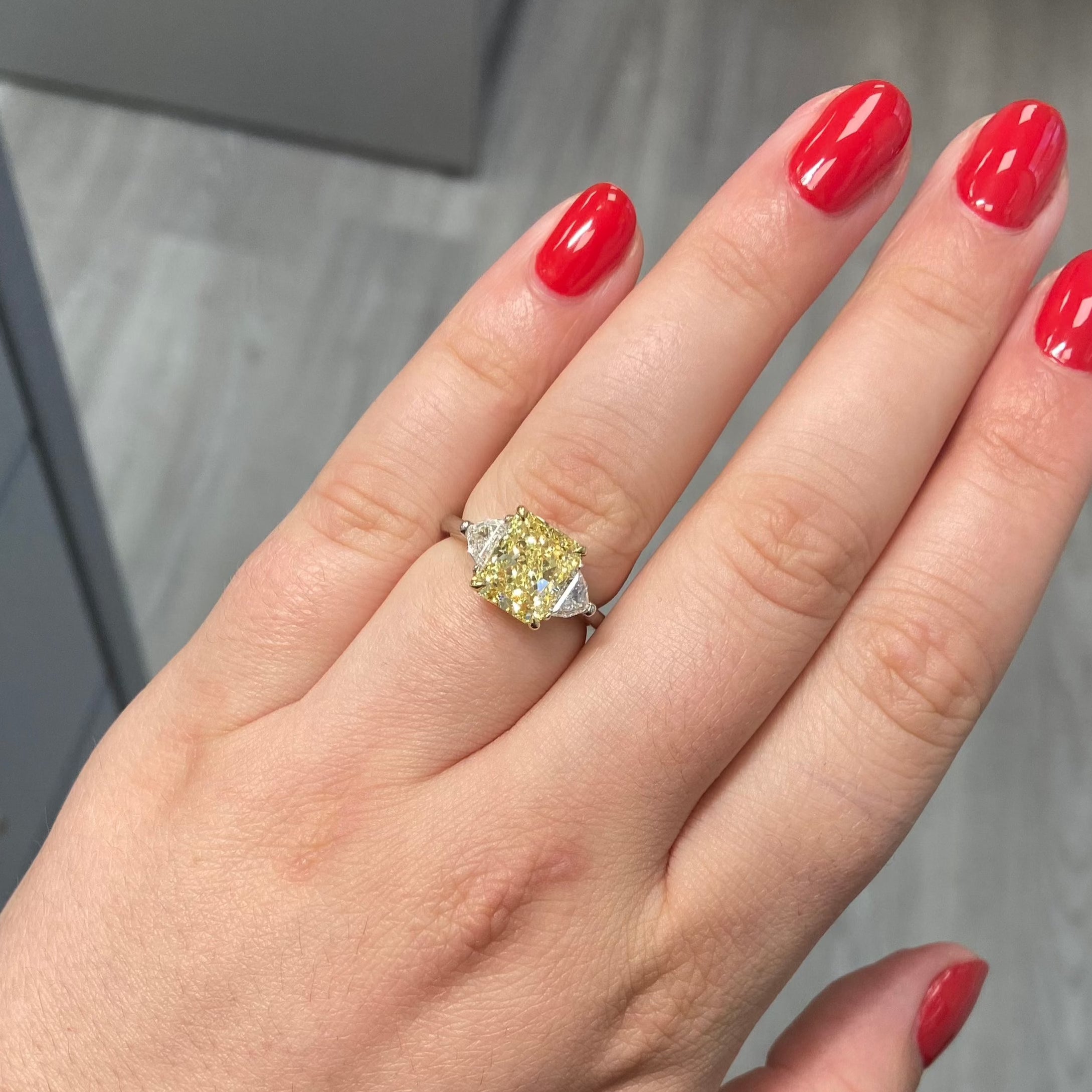 3.06ct Fancy Yellow Elongated Radiant Diamond Three Stone Ring