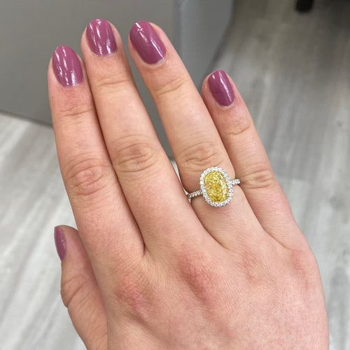 yellow diamond ring with white halo. halo diamond engagement ring. fancy yellow oval. 3 carat oval diamond. yellow diamond engagement ring.