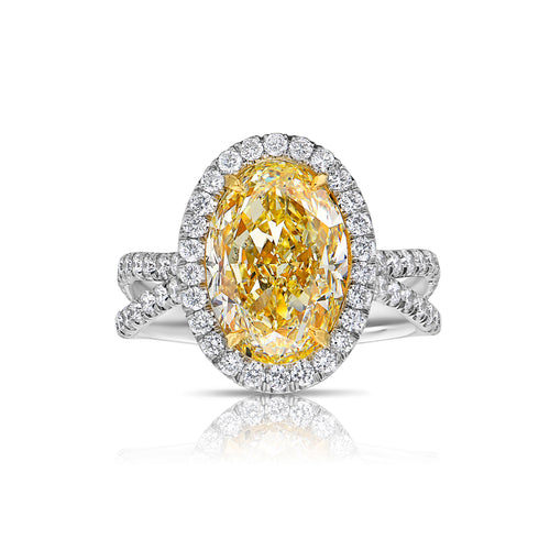 Fancy yellow diamond oval ring. yellow diamond halo ring. 4 carat yellow ring. oval yellow diamond. yellow diamond oval shape.