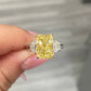 fancy yellow diamond ring. 4 carat yellow diamond. Elongated radiant. long radiant yellow diamond. yellow diamond 3 stone ring