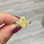 Fancy yellow diamond ring. Yellow diamond engagement ring. Canary diamond ring. Oval engagement ring. Fancy yellow diamond. Yellow diamond 3 stone ring. Fancy yellow. Oval diamond ring.