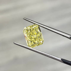 natural diamond. fancy colored diamond. yellow diamond. fancy intense yellow diamond. fancy intense yellow. fancy yellow diamond. yellow diamond radiant cut. radiant cut diamond.