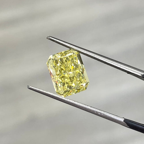 natural diamond. fancy colored diamond. yellow diamond. fancy intense yellow diamond. fancy intense yellow. fancy yellow diamond. yellow diamond radiant cut. radiant cut diamond.