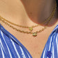 Canary diamond necklace, yellow heart shape diamond on a golden chain, bezel set yellow diamond