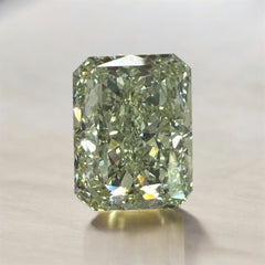 GIA certified fancy intense yellowish green radiant diamond with a vibrant hue and VS2 clarity.