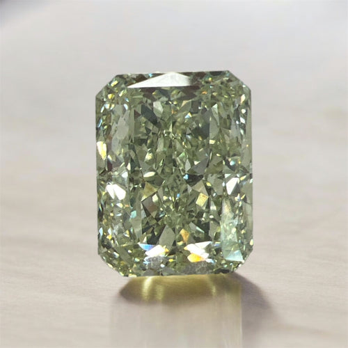 GIA certified fancy intense yellowish green radiant diamond with a vibrant hue and VS2 clarity.