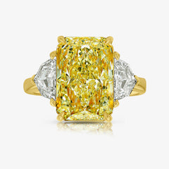 5 carat fancy light yellow elongated radiant cut diamond ring in yellow gold
