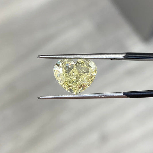 natural diamond. fancy colored diamond. yellow diamond. yellow heart diamond. fancy yellow diamond. yellow diamond heart shape.