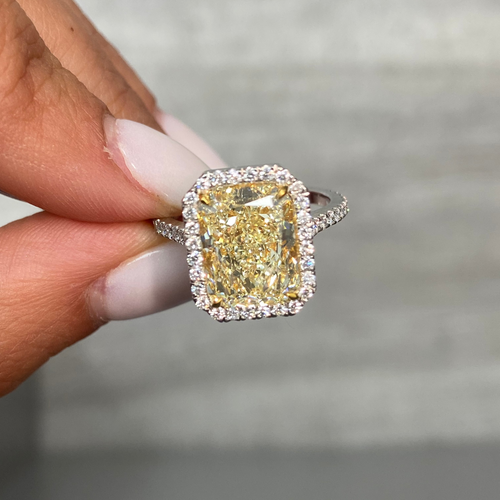 5 Carat Light Yellow elongated radiant cut  in halo diamond ring