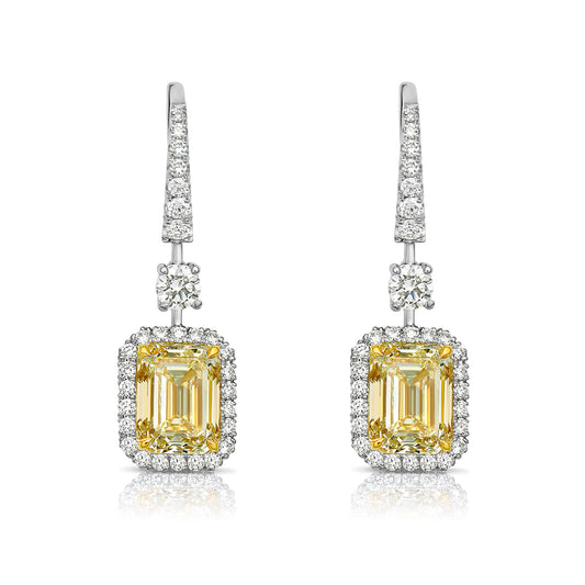 Yellow diamond studs. Yellow diamond earrings. Cushion cut diamond earrings. Yellow diamond earrings. Canary yellow diamond earrings. yellow diamond emerald cut.