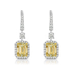 Yellow diamond studs. Yellow diamond earrings. Cushion cut diamond earrings. Yellow diamond earrings. Canary yellow diamond earrings. yellow diamond emerald cut.