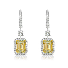 Yellow diamond studs. Yellow diamond earrings. Cushion cut diamond earrings. Yellow diamond earrings. Canary yellow diamond earrings. yellow diamond emerald cut.