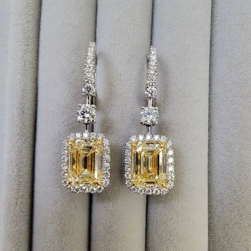 Yellow diamond studs. Yellow diamond earrings. Cushion cut diamond earrings. Yellow diamond earrings. Canary yellow diamond earrings. yellow diamond emerald cut.