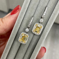 Yellow diamond studs. Yellow diamond earrings. Cushion cut diamond earrings. Yellow diamond earrings. Canary yellow diamond earrings. yellow diamond emerald cut.