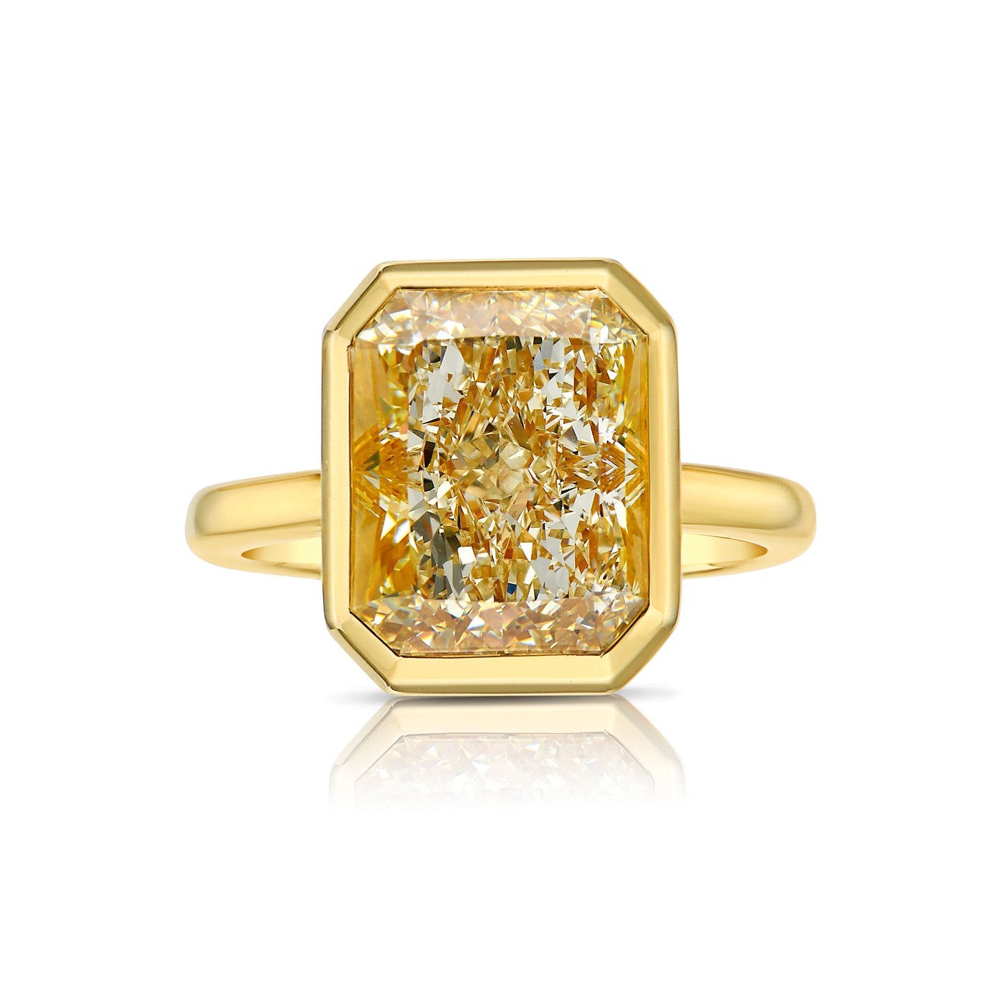 Yellow diamond ring. Fancy yellow diamond ring. yellow diamond bezel ring. yellow diamond jewelry.