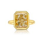 Yellow diamond ring. Fancy yellow diamond ring. yellow diamond bezel ring. yellow diamond jewelry.