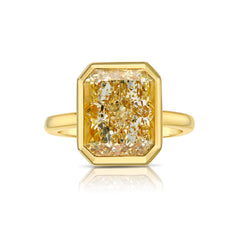 Yellow diamond ring. Fancy yellow diamond ring. yellow diamond bezel ring. yellow diamond jewelry.