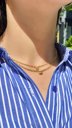 Canary diamond necklace, yellow oval cut diamond on a golden chain, bezel set yellow diamond