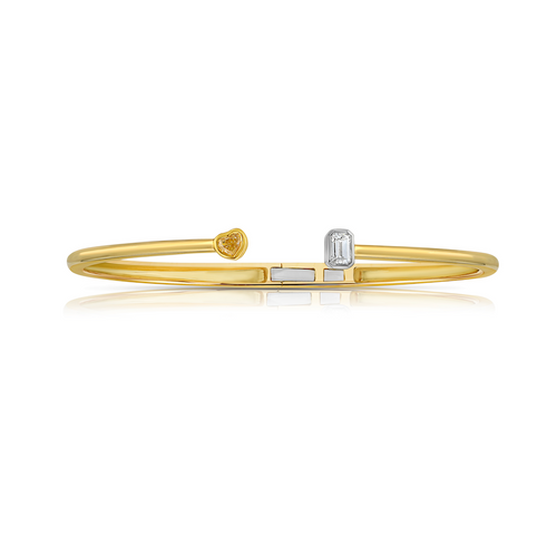 Unique bezel set bangle bracelet with yellow and white elongated diamonds.