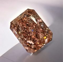 GIA certified fancy brown-pink elongated radiant diamond with VS1 clarity and no fluorescence.