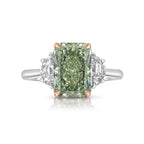 Natural green diamond engagement ring with a radiant cut center and yellow diamond accents.