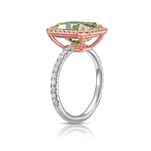 Elegant radiant cut engagement ring featuring a fancy greenish yellow elongated diamond with SI2 clarity.