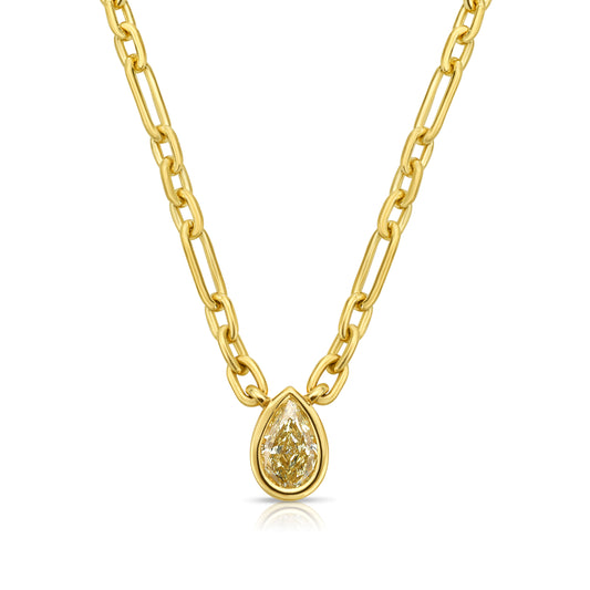 Canary diamond necklace, yellow pear shape diamond on a golden chain, bezel set yellow diamond