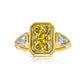 Bezel set three stone diamond ring, unique gold engagement ring, featuring a GIA certified fancy light yellow elongated radiant cut diamond