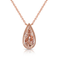 Rose gold teardrop diamond necklace on a white background