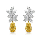 Fancy Light Yellow pear shape diamond earrings Natural yellow pear shape diamond cluster drop earrings with a total of 13.29 carats of natural white and yellow diamonds. Featuring 3 carat each, GIA Certified Fancy Light Yellow pear shape center diamonds with VS1 and VVS2 clarity.