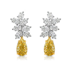 Fancy Light Yellow pear shape diamond earrings Natural yellow pear shape diamond cluster drop earrings with a total of 13.29 carats of natural white and yellow diamonds. Featuring 3 carat each, GIA Certified Fancy Light Yellow pear shape center diamonds with VS1 and VVS2 clarity.