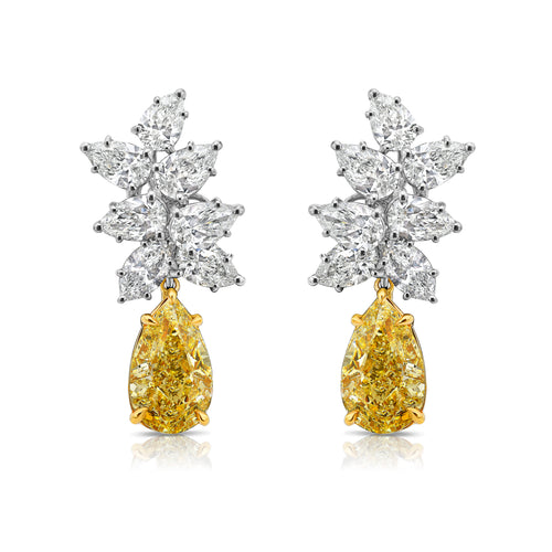 Fancy Light Yellow pear shape diamond earrings Natural yellow pear shape diamond cluster drop earrings with a total of 13.29 carats of natural white and yellow diamonds. Featuring 3 carat each, GIA Certified Fancy Light Yellow pear shape center diamonds with VS1 and VVS2 clarity.