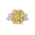 Elegant fancy light yellow elongated radiant diamond ring with VS2 clarity, unique and striking design.