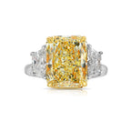 Fancy light yellow elongated radiant cut diamond engagement ring with VVS1 clarity.