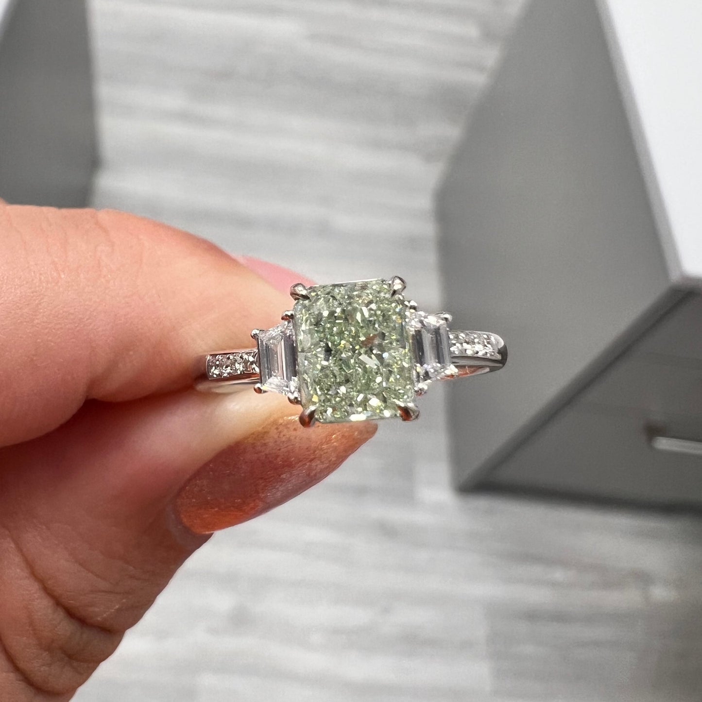 Green Elongated radiant diamond ring. GIA green diamond. Natural green diamond. JLO green diamond ring