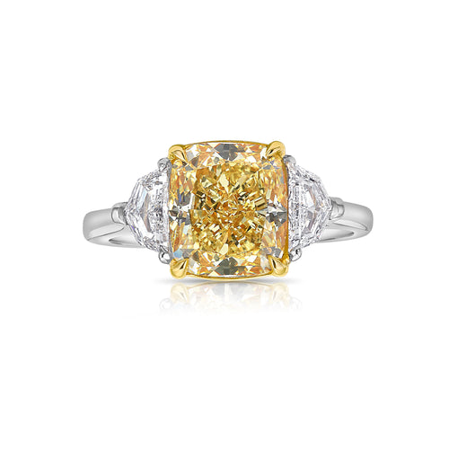 Fancy yellow elongated cushion diamond elongated diamond canary diamond three stone engagement ring, GIA certified.