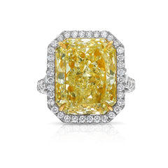 GIA certified elongated radiant yellow diamond halo ring, featuring a soft and sweet yellow hue.