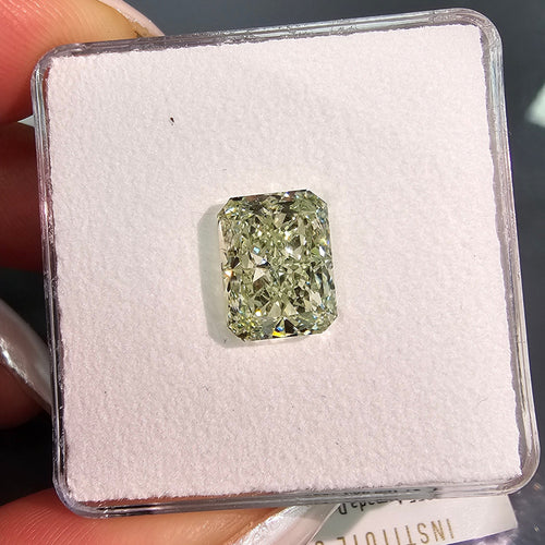 GIA certified fancy intense yellowish green radiant diamond with a vibrant hue and VS2 clarity.