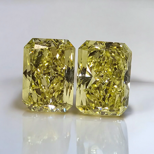 Fancy intense yellow diamond ring in pair, GIA certified.