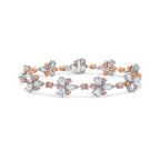 Elegant bracelet featuring fancy pink pear and cushion diamonds with white rose-cut pear diamonds.