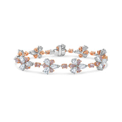 Elegant bracelet featuring fancy pink pear and cushion diamonds with white rose-cut pear diamonds.